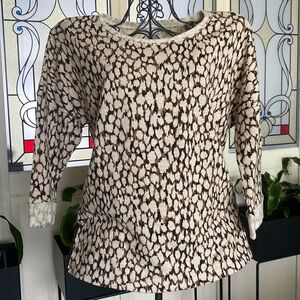Size medium shirt with quarter length sleeves.
